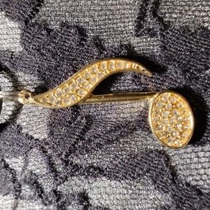 18-22",Black cotton necklace w/a gold plated w/rhinestones ,musical note pendant